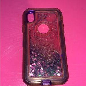 Purple outer box phone case with glitter in it.